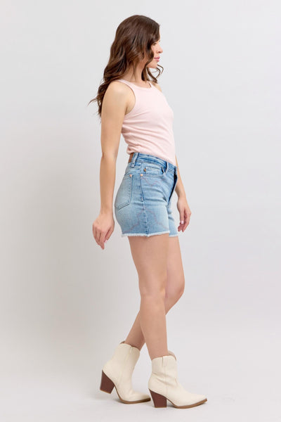 Judy Blue high-rise shorts with western embroidery and raw hem.