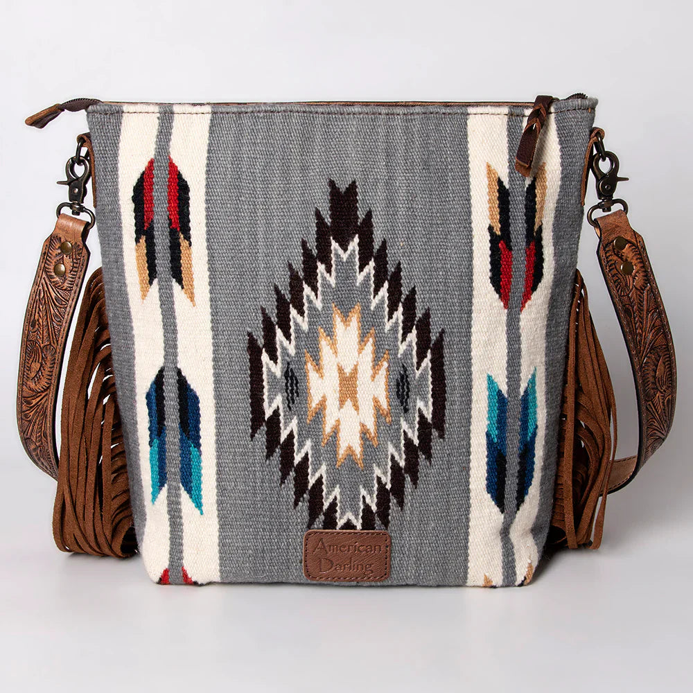 American Darling large crossbody bag with hand tooled leather strap, western wool saddle blanket design, and leather fringes