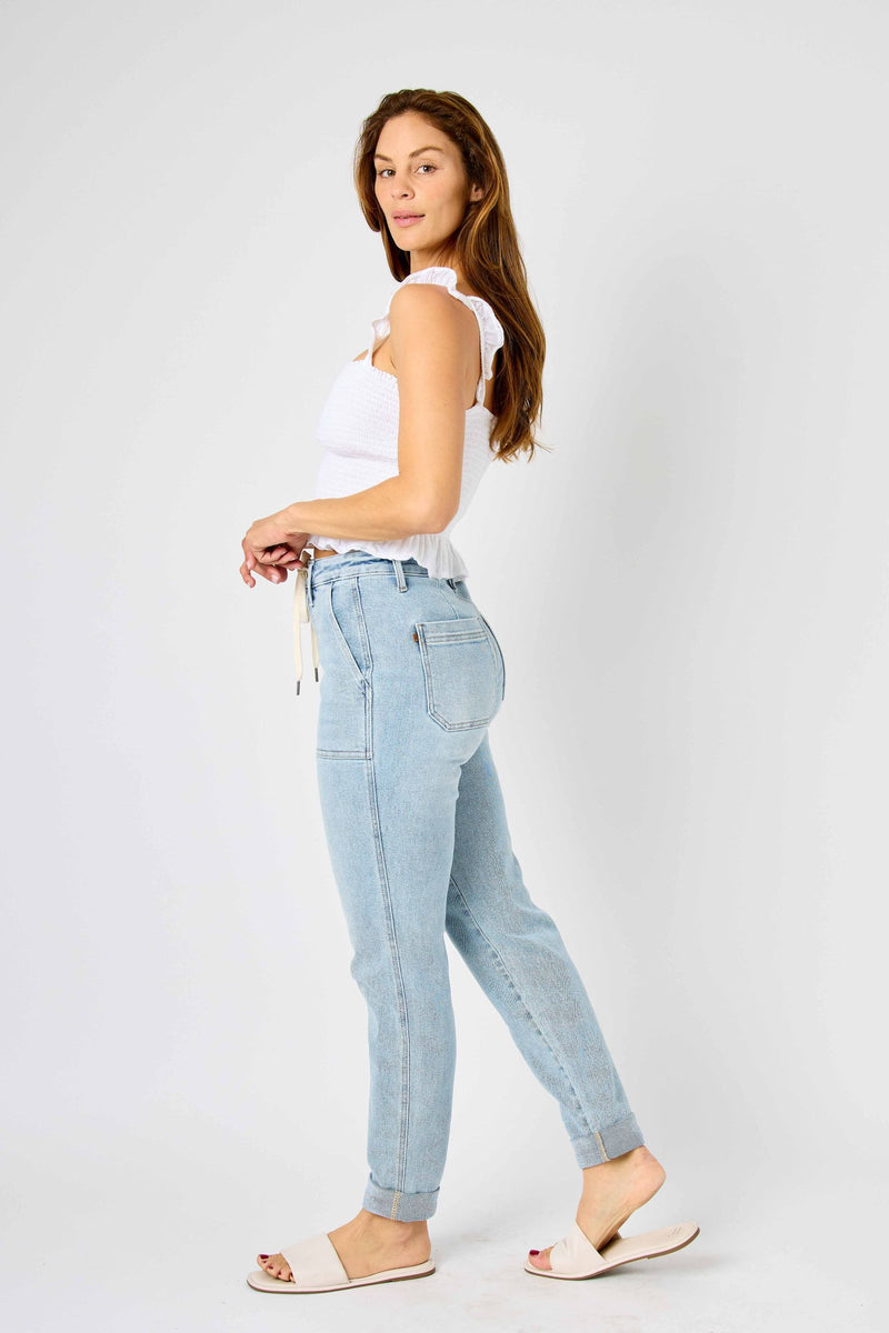 Woman modeling high waist vintage double-cuffed Judy Blue Jeans in light wash denim.