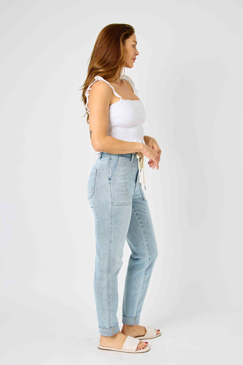 Side view of woman wearing high waist vintage double-cuffed Judy Blue Jeans joggers