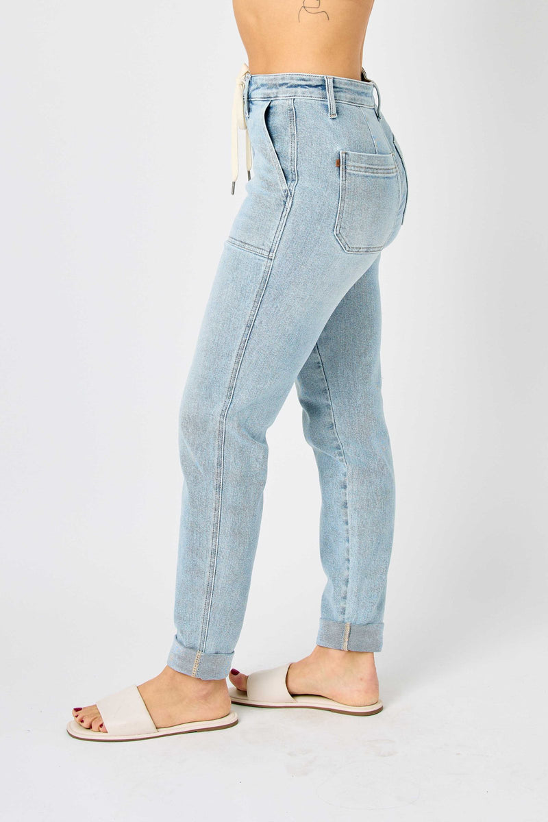 Side view of high waist vintage double-cuffed Judy Blue Jeans jogger in light wash denim