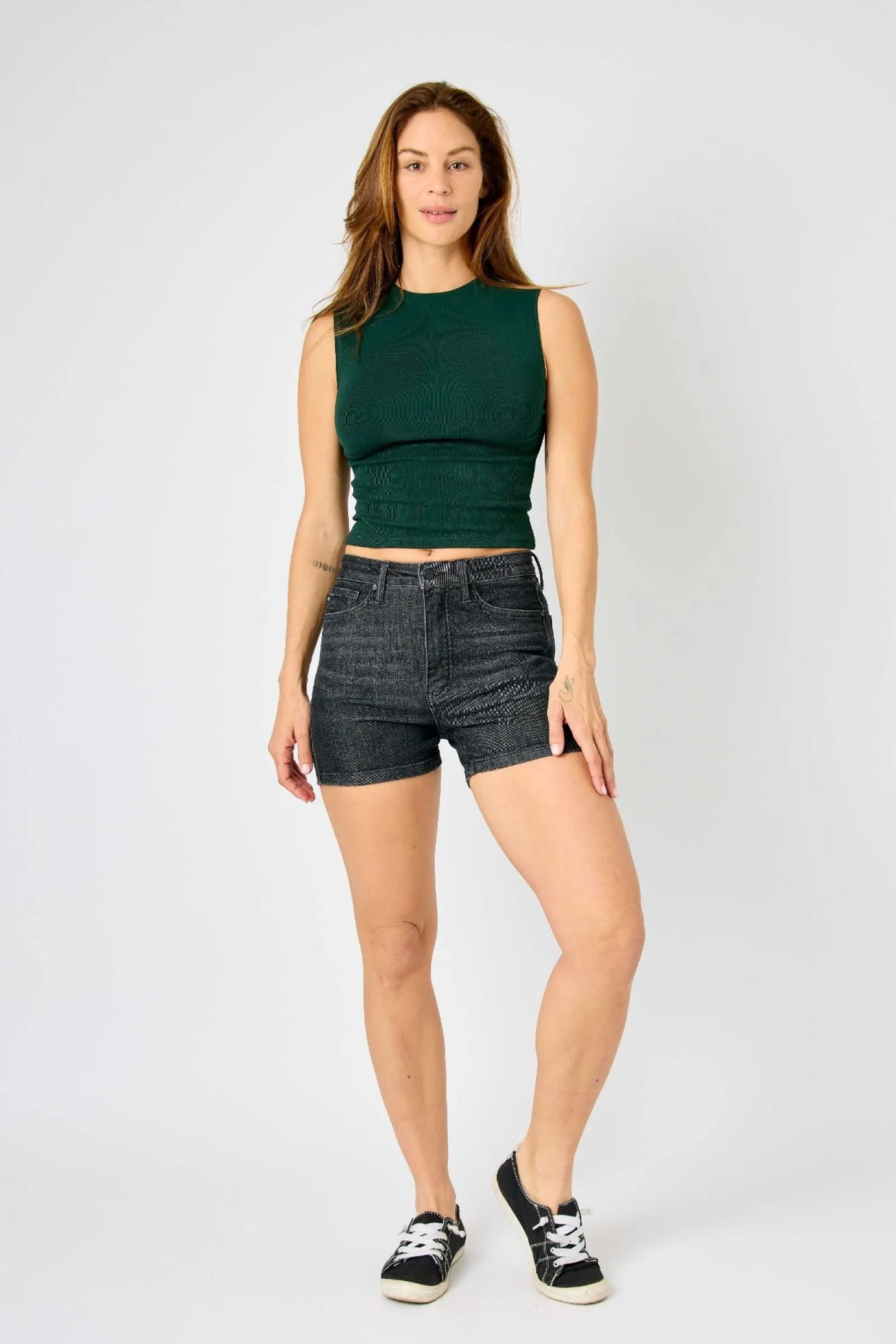 Mid-rise vintage wash Judy Blue shorts with tummy control and release hem detailing.