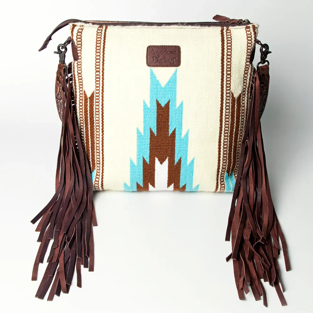 American Darling Large Crossbody Messenger Bag ADBGZ306G with hand tooled cowhide leather, wool saddle blanket design, leather fringes, and adjustable strap.
