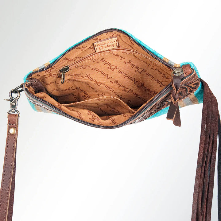 American Darling Wristlet Wallet ADBG344J with hand-tooled genuine cowhide leather, wool saddle blanket, leather fringes, and durable YKK zipper closure opened to show interior compartments