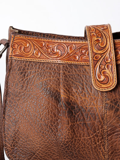 Close-up of American Darling Crossbody Bag ADBGZ426C in hand-tooled full grain vegetable tanned American cowhide leather with antique finish and adjustable shoulder strap.