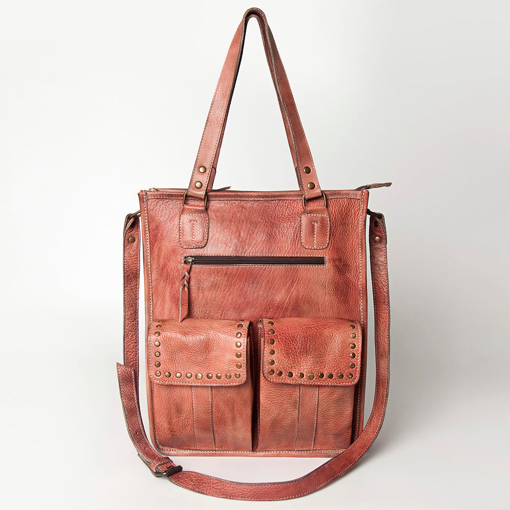 Premium full grain leather tote bag with adjustable strap, antique metal fittings, and decorative rivets.