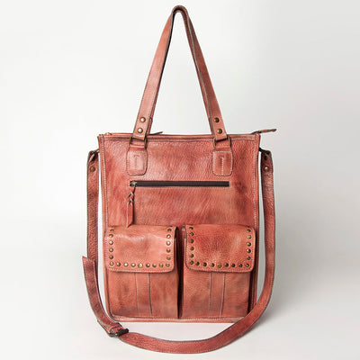 Premium full grain leather tote bag with adjustable strap, antique metal fittings, and decorative rivets.