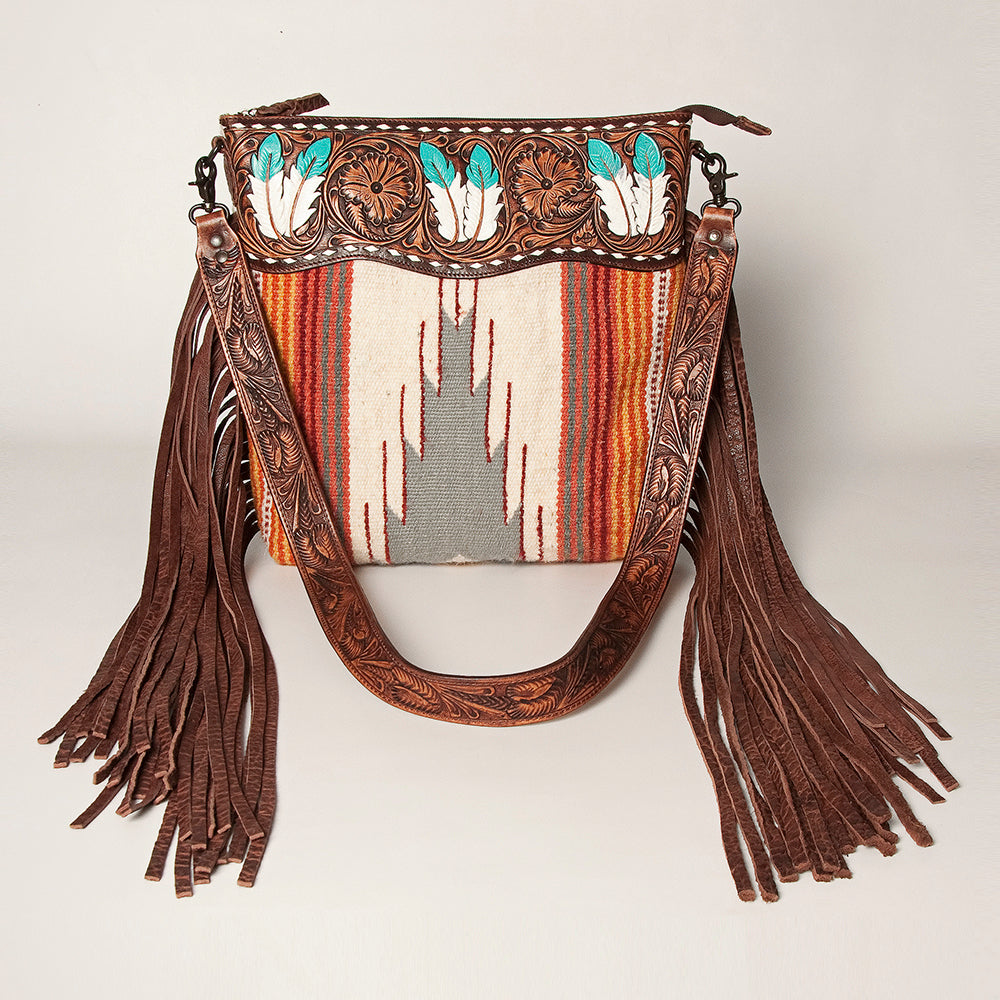American Darling Shoulder Bag ADBGZ365A with intricate leather tooling, feather designs, colorful woven fabric, and long leather fringe tassels