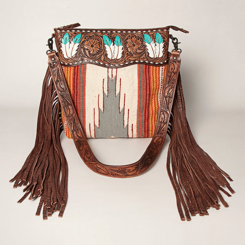 American Darling Shoulder Bag ADBGZ365A with intricate leather tooling, feather designs, colorful woven fabric, and long leather fringe tassels