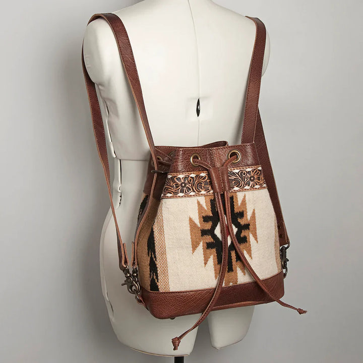 American Darling leather bucket bag backpack with handwoven southwestern wool and hand-tooled floral leather trim