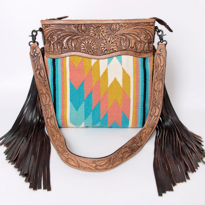 American Darling large crossbody messenger bag handcrafted with tooled leather and colorful woven wool saddle blanket, featuring leather fringes and adjustable strap
