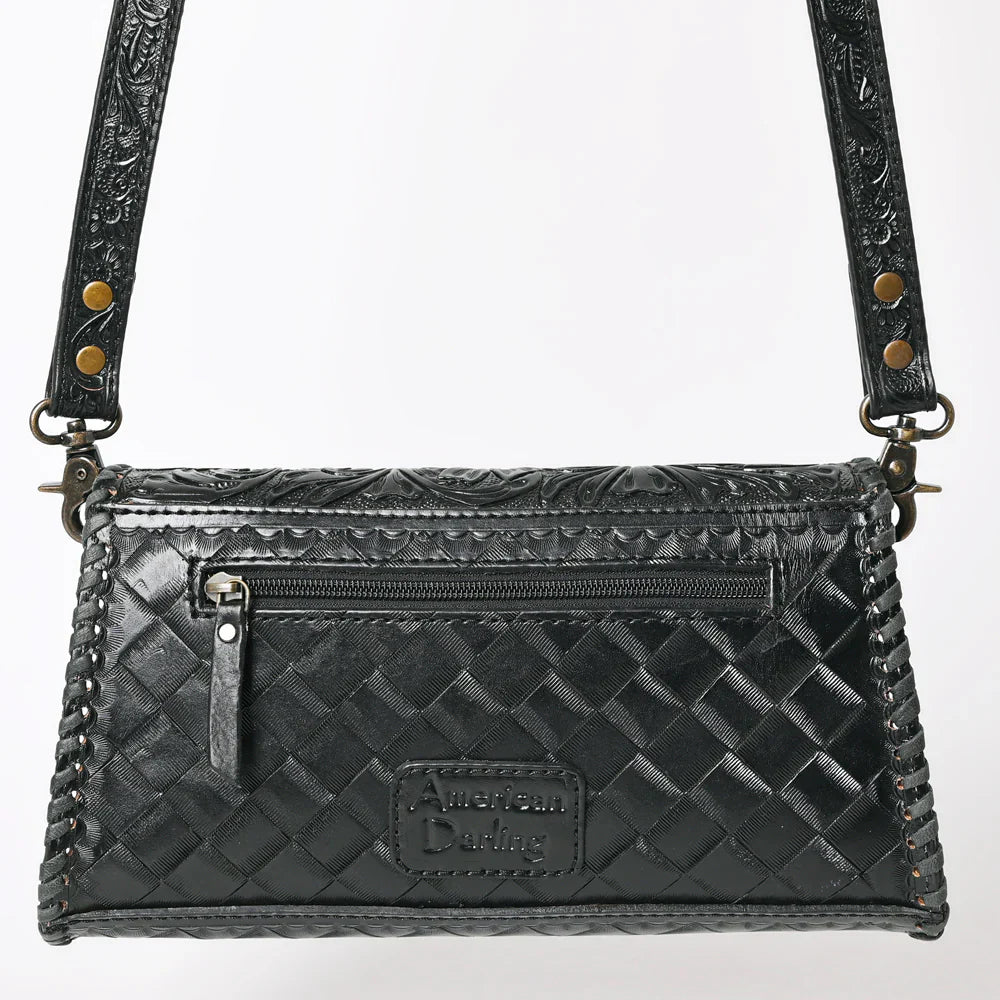 Black American Darling crossbody bag with hand-tooled vegetable tanned cowhide leather, detailed braiding, adjustable strap, and YKK zipper.