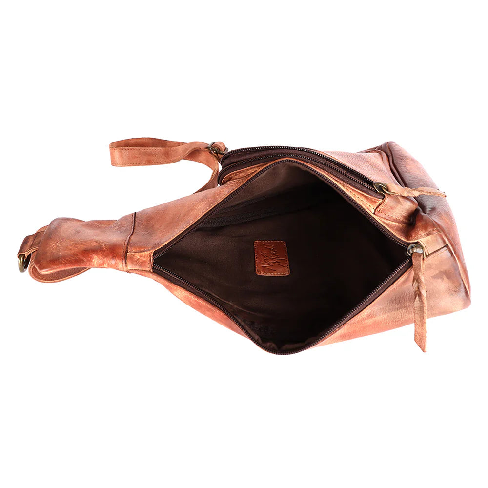 Open top view of Never Mind Sling bag made of premium full grain leather with antique finish metal fittings and adjustable leather strap