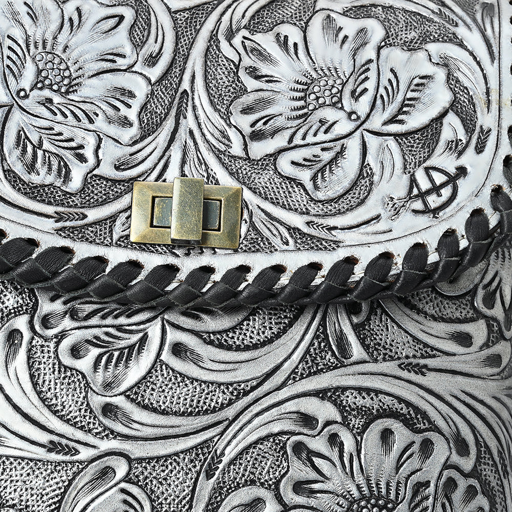 Close-up of American Darling small crossbody bag featuring detailed hand-tooled floral design on vegetable tanned genuine cowhide leather with braided leather trim and antique metal clasp.