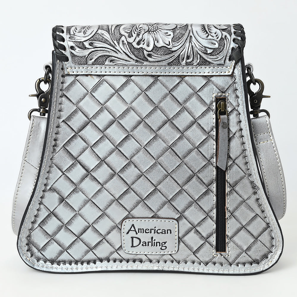 American Darling small crossbody bag in silver full grain leather with hand-tooled floral design, braided details, antique metal fittings, and adjustable shoulder strap