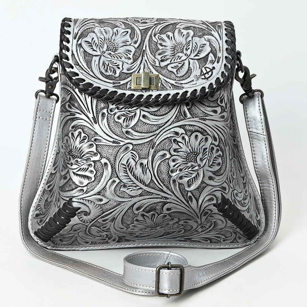 American Darling small crossbody bag in hand-tooled, carved vegetable tanned cowhide leather with adjustable strap and antique metal fittings