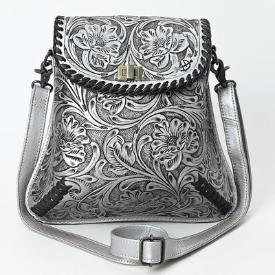 American Darling small crossbody bag in hand-tooled, carved vegetable tanned cowhide leather with adjustable strap and antique metal fittings