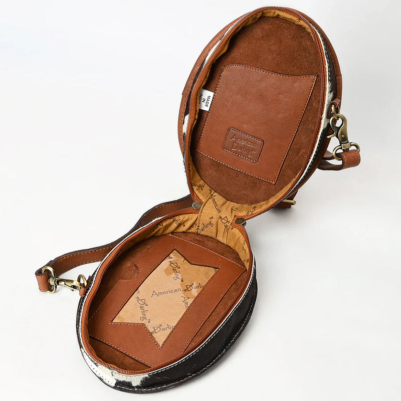 Open American Darling Canteen with detailed hand-tooled full grain cowhide leather and adjustable shoulder strap shown inside view
