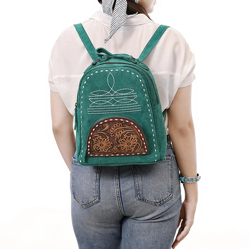 American Darling genuine Western leather backpack with intricate patterns, worn by a woman, showcasing adjustable straps and a stylish, durable design.