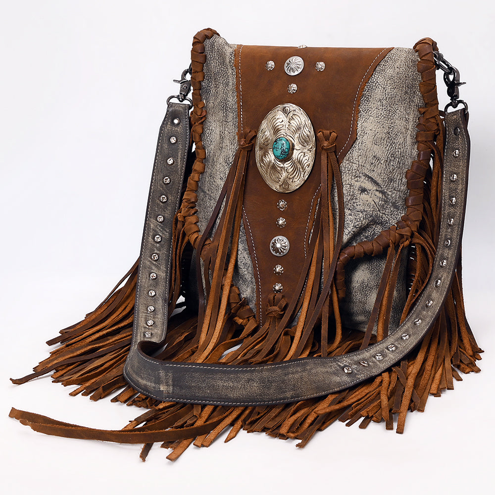 American Darling Crossbody Bag in full grain leather with turquoise stone accent, leather fringes, and antique metal fittings.