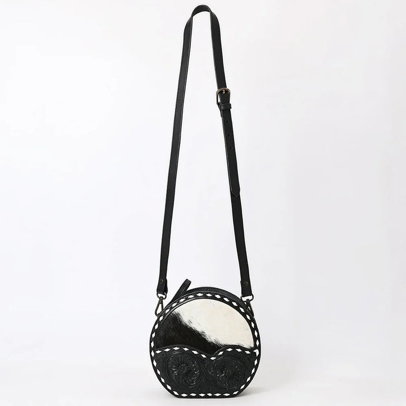American Darling Canteen Bag made of hand-tooled vegetable tanned cowhide leather with adjustable strap and antique metal fittings