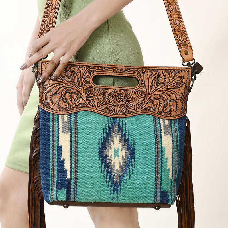 American Darling Clutch Handbag ADBGS146P with hand-tooled American cowhide leather, woven wool saddle blanket, leather fringes, adjustable strap, and YKK zipper closure.