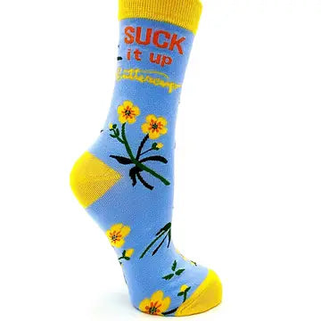Suck It Up Buttercup women's crew socks in blue with yellow accents and floral design, featuring bold text and comfortable fit.