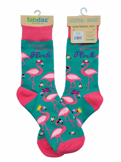 Women's novelty crew socks with pink flamingos and "I Don't Give a Flock" text, soft breathable fabric.