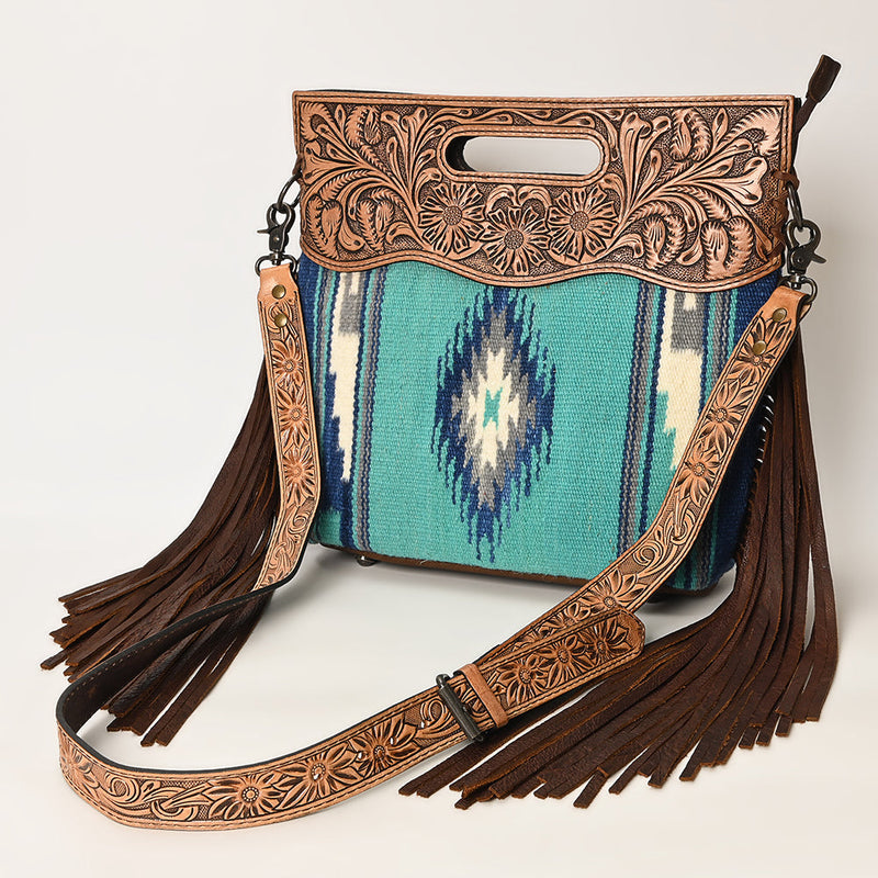 American Darling Clutch Handbag ADBGS146P with carved vegetable tanned cowhide leather, handwoven wool saddle blanket, leather fringes, adjustable strap, and YKK zipper closure.