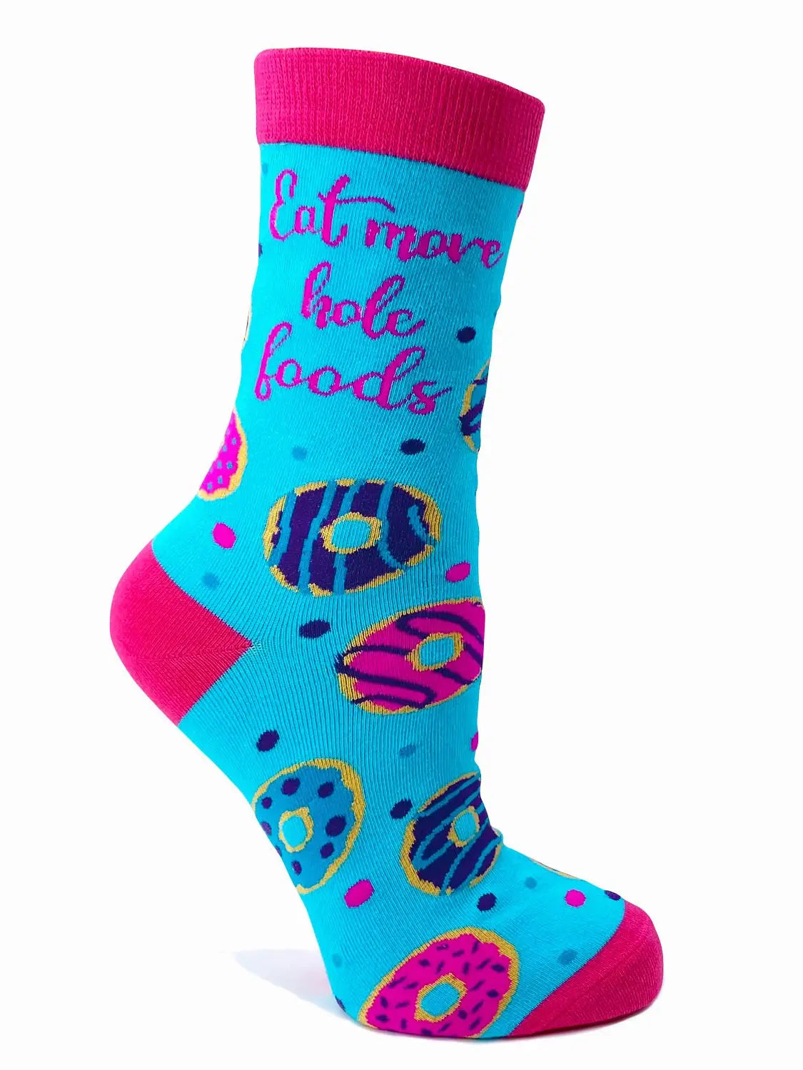 Women's novelty socks with colorful donut design and "Eat More Hole Foods" pun text, blue with pink accents.