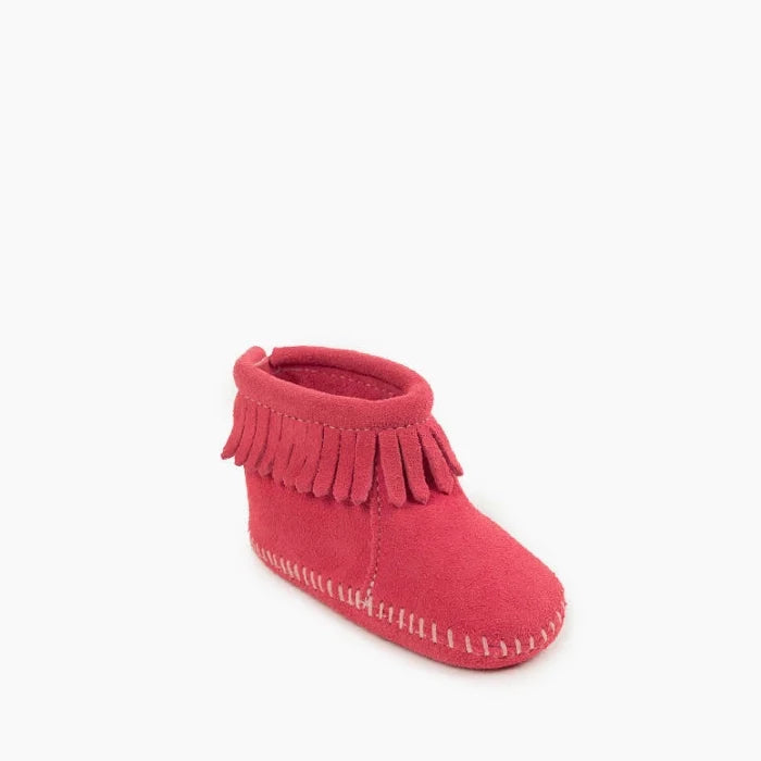 Red suede Minnetonka Back Flap Bootie for kids with fringe and Velcro® closure.