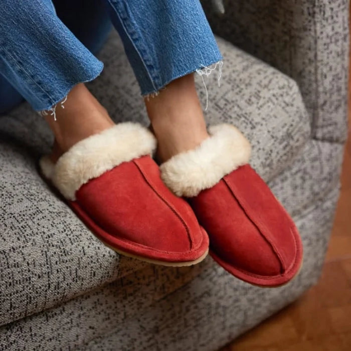 Pre Order Minnetonka SHEEPSKIN SLIDE SHOES in red, crafted with premium sheepskin, featuring open-back design and flexible sole.