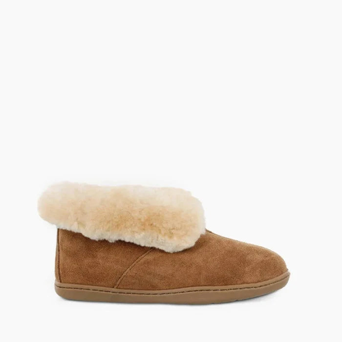 Minnetonka Sheepskin Ankle Boot with suede and sheepskin lining, fold-up collar, and rubber sole.