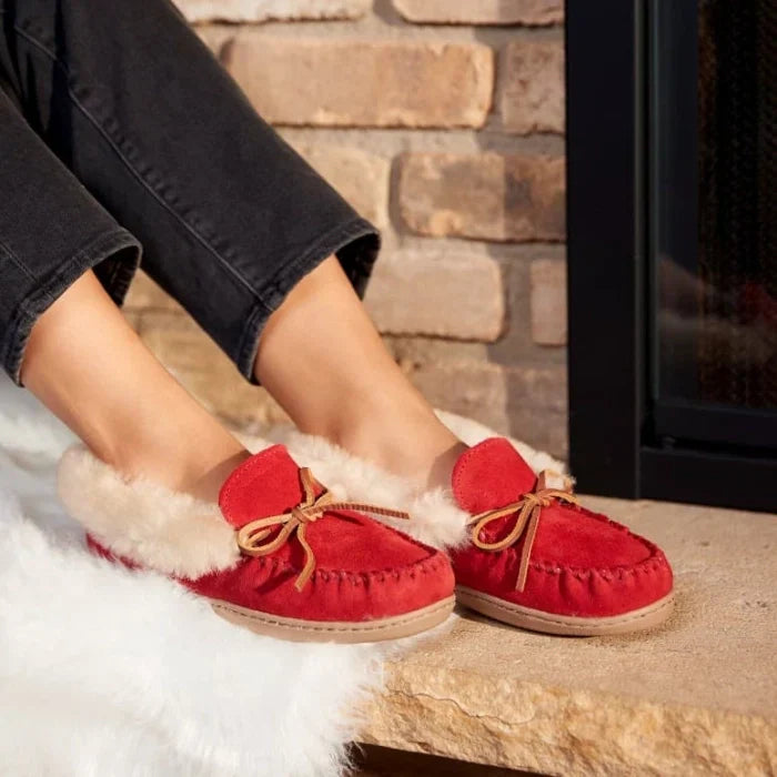 Minnetonka Alpine Sheepskin Moccasins in red suede with plush lining, ideal for cozy indoor and outdoor wear.