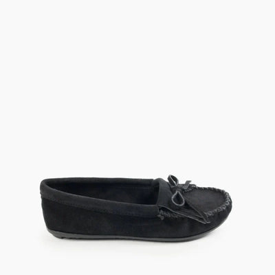 Minnetonka Kilty Hardsole moccasin in black suede with intricate stitching and durable rubber sole.