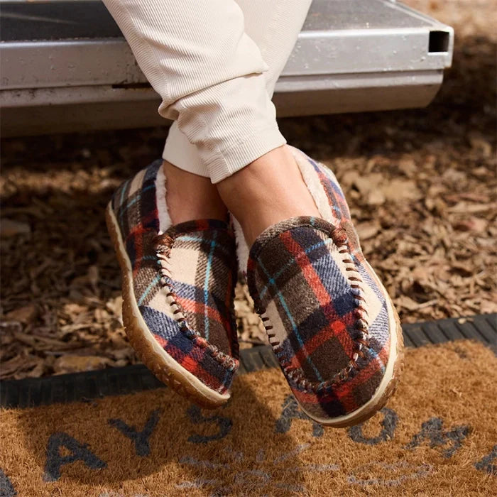 Water-resistant Minnetonka Tempe shoes with plaid design, cozy lining, and durable sole.