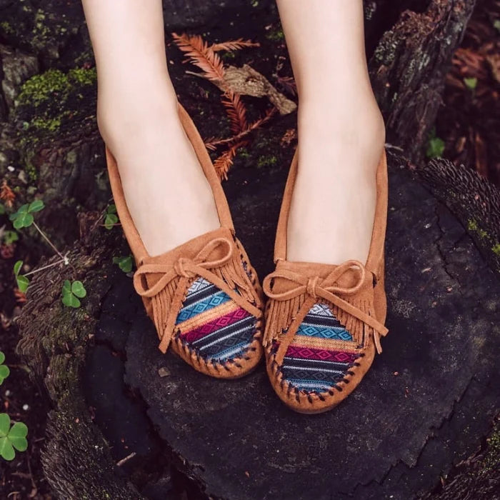 Minnetonka KILTY HARDSOLE moccasin in premium suede with intricate stitching and beading.