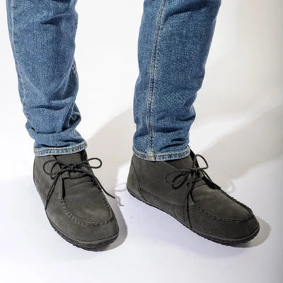 Pre Order Minnetonka MEN’S TORREY SHOES with durable cotton lace and eco-friendly MinnTREAD rubber, worn with jeans.