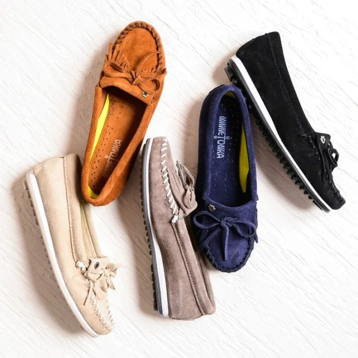 Minnetonka KILTY PLUS moccasins in various colors featuring suede finish, durable rubber sole, and fringe detailing, perfect for pre-order.