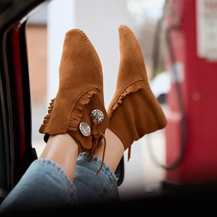 Minnetonka Two Button Boot for women in soft suede, features decorative buttons and padded insole.