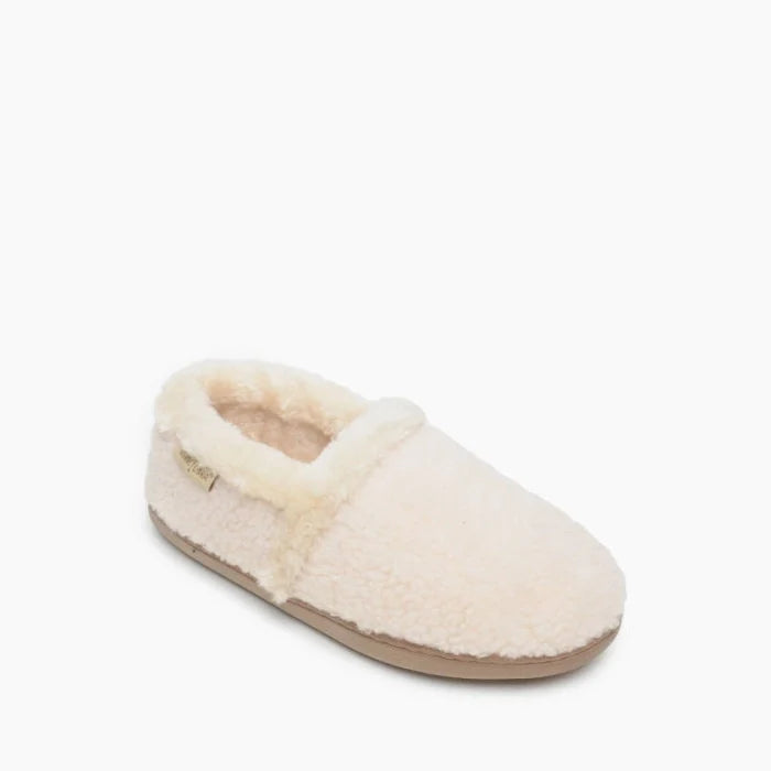 Cream colored Minnetonka DINA slippers with soft pile lining and durable rubber sole.