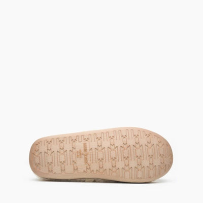 Sole of Minnetonka DINA slippers with durable rubber design for grip.