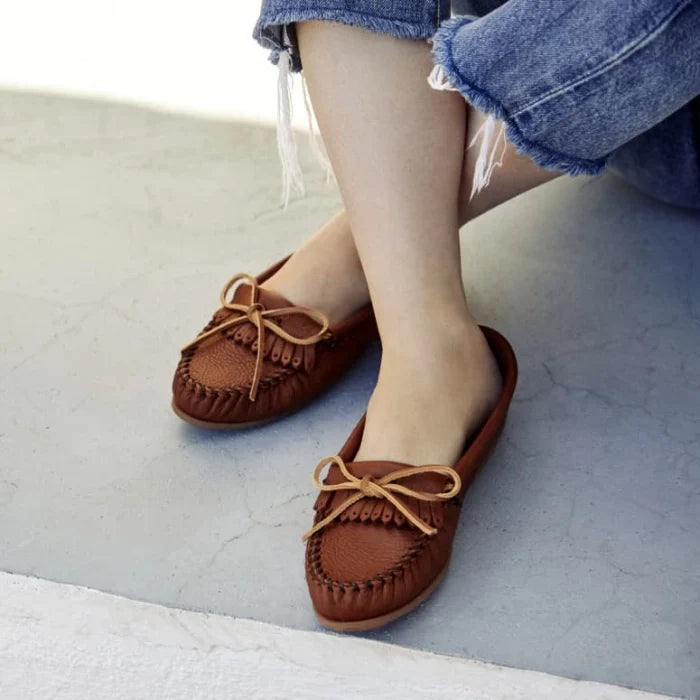Women wearing Minnetonka DEERSKIN Kilty moccasins with rawhide lace and rubber sole