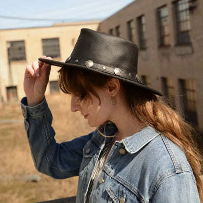 woman wearing black genuine leather Buffalo Nickel Hat with braided hatband and western buffalo nickel accents outdoors