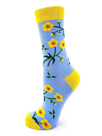Suck It Up Buttercup women's crew socks with yellow floral design on blue background and yellow cuff, heel, and toe.