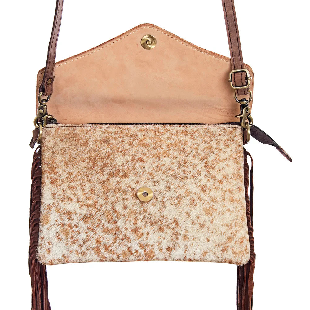 American Darling small crossbody messenger bag with cowhide leather, fringe details, and turquoise stone accent.