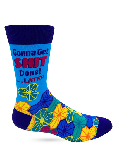 Men's novelty crew sock featuring bold "Gonna Get SHIT Done! ... Later" text with colorful geometric floral pattern