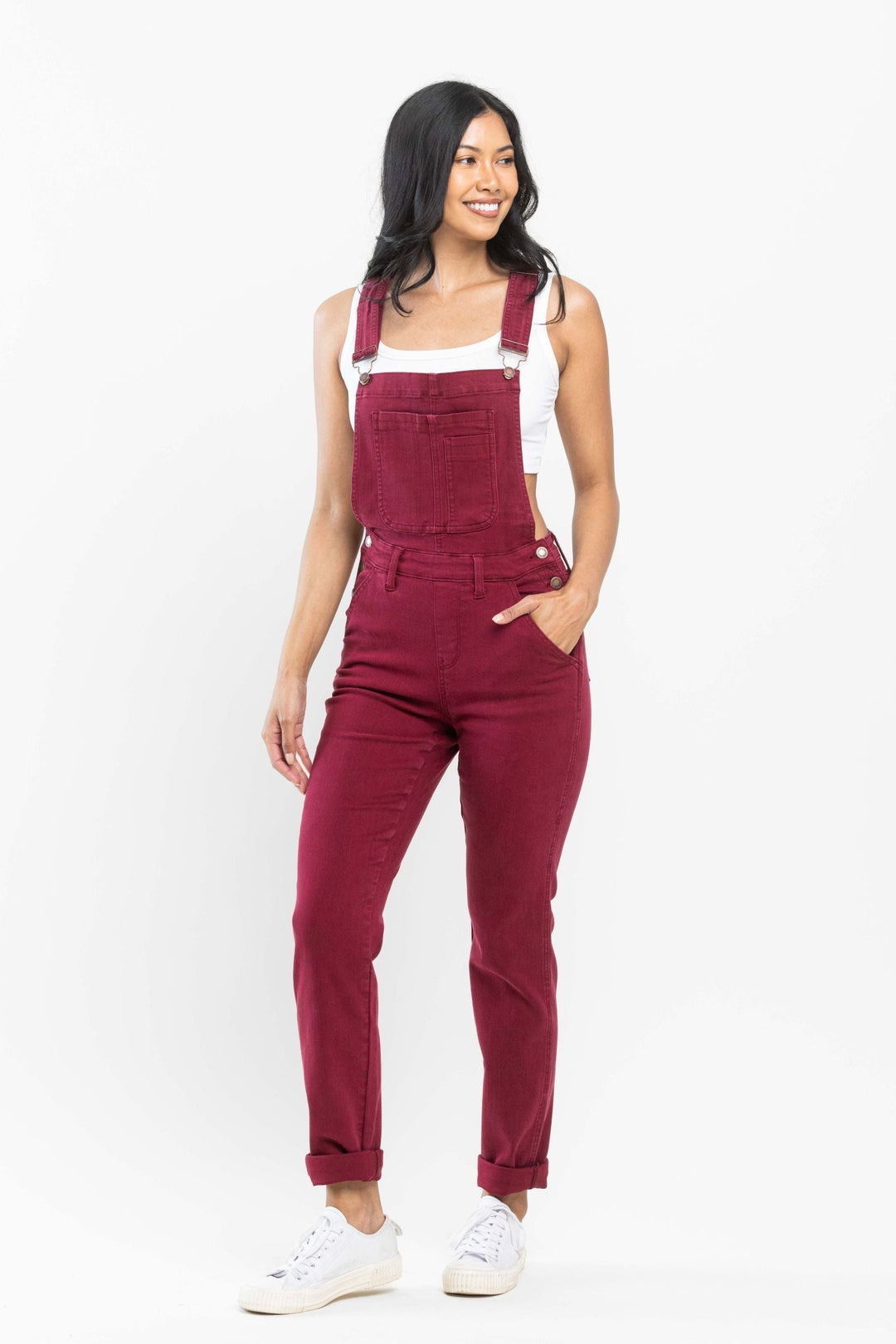 Woman wearing crimson Judy Blue Overalls 88712 with boyfriend fit straight leg and 27-inch inseam