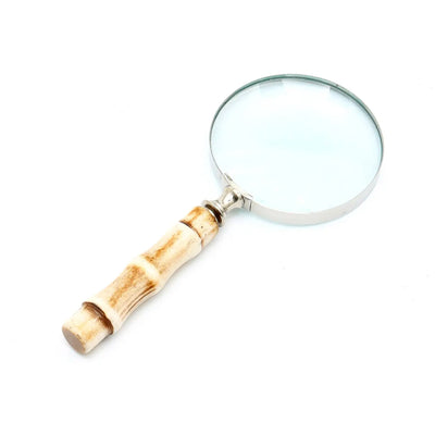 Magnifying glass with smooth resin handle and silver electroplated steel frame, perfect for reading and décor.