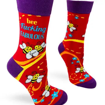 Red crew socks with purple cuffs and heels, featuring cheerful bees and the phrase "bee fucking fabulous" in bold letters, designed for confident and stylish women.